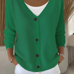 Woman wearing a plain long sleeve loose-fit V-neck casual cardigan