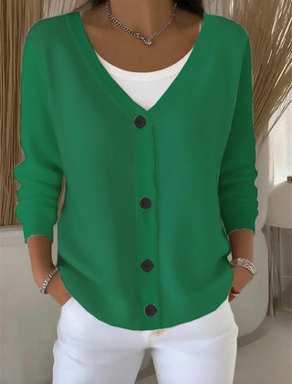 Woman wearing a plain long sleeve loose-fit V-neck casual cardigan