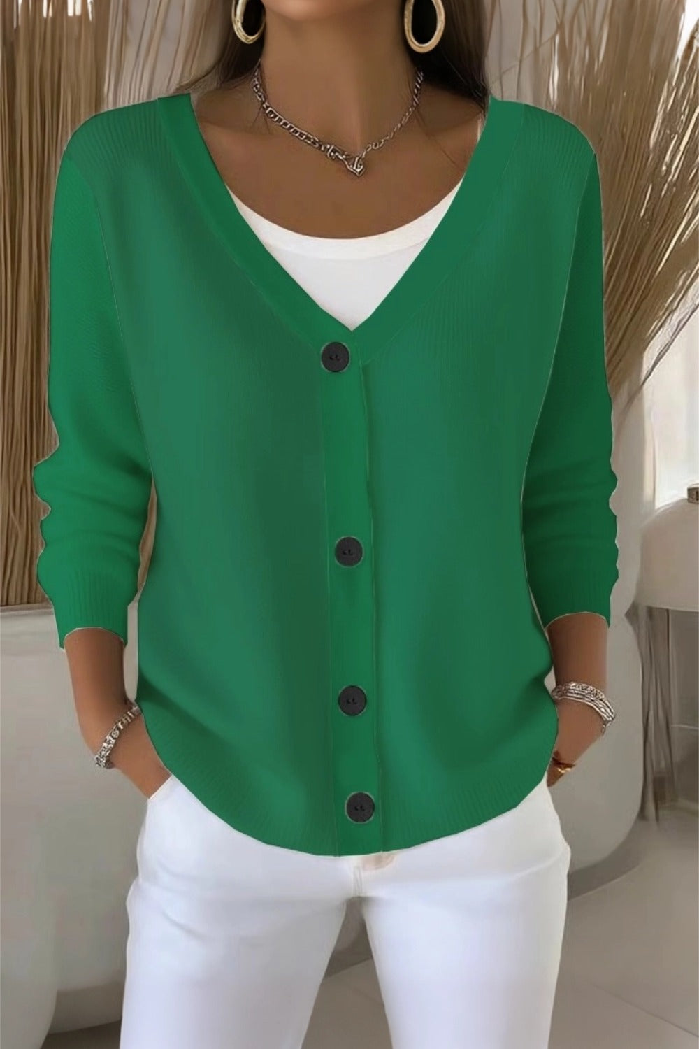 Woman wearing a plain long sleeve loose-fit V-neck casual cardigan