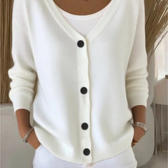 Woman wearing a plain long sleeve loose-fit V-neck casual cardigan