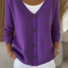 Woman wearing a plain long sleeve loose-fit V-neck casual cardigan