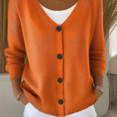 Woman wearing a plain long sleeve loose-fit V-neck casual cardigan