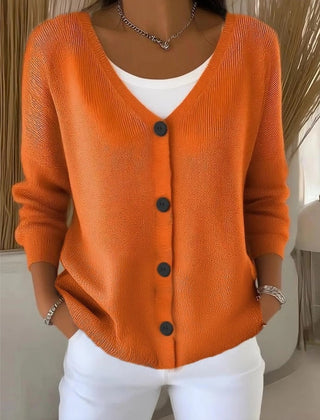 Woman wearing a plain long sleeve loose-fit V-neck casual cardigan