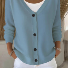 Woman wearing a plain long sleeve loose-fit V-neck casual cardigan