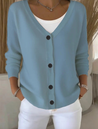 Woman wearing a plain long sleeve loose-fit V-neck casual cardigan