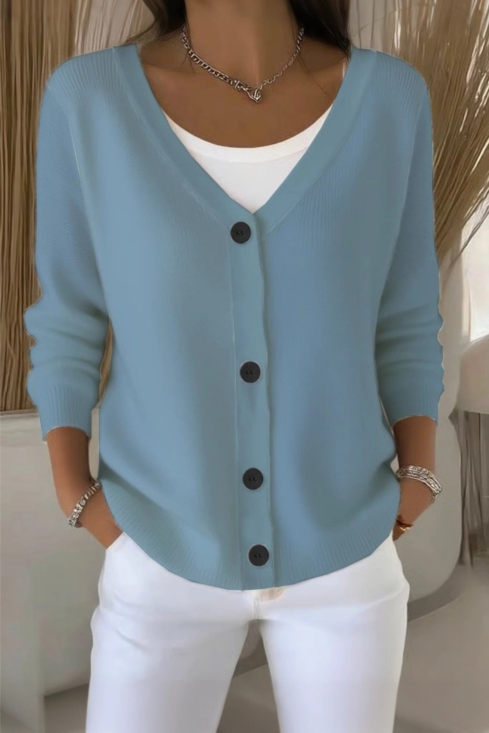 Woman wearing a plain long sleeve loose-fit V-neck casual cardigan