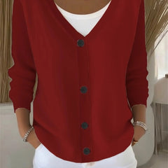 Woman wearing a plain long sleeve loose-fit V-neck casual cardigan