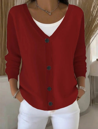 Woman wearing a plain long sleeve loose-fit V-neck casual cardigan