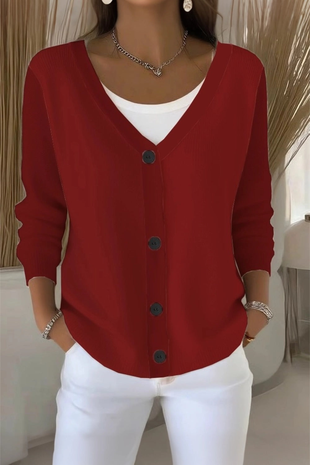 Woman wearing a plain long sleeve loose-fit V-neck casual cardigan