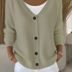 Woman wearing a plain long sleeve loose-fit V-neck casual cardigan