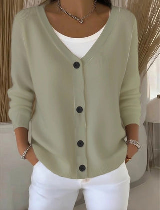 Woman wearing a plain long sleeve loose-fit V-neck casual cardigan