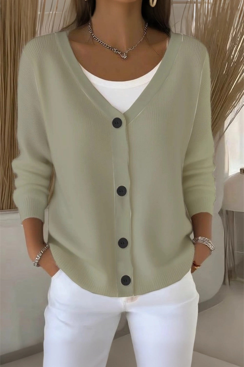 Woman wearing a plain long sleeve loose-fit V-neck casual cardigan