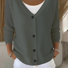 Woman wearing a plain long sleeve loose-fit V-neck casual cardigan