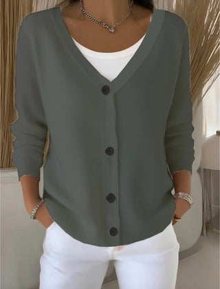 Woman wearing a plain long sleeve loose-fit V-neck casual cardigan