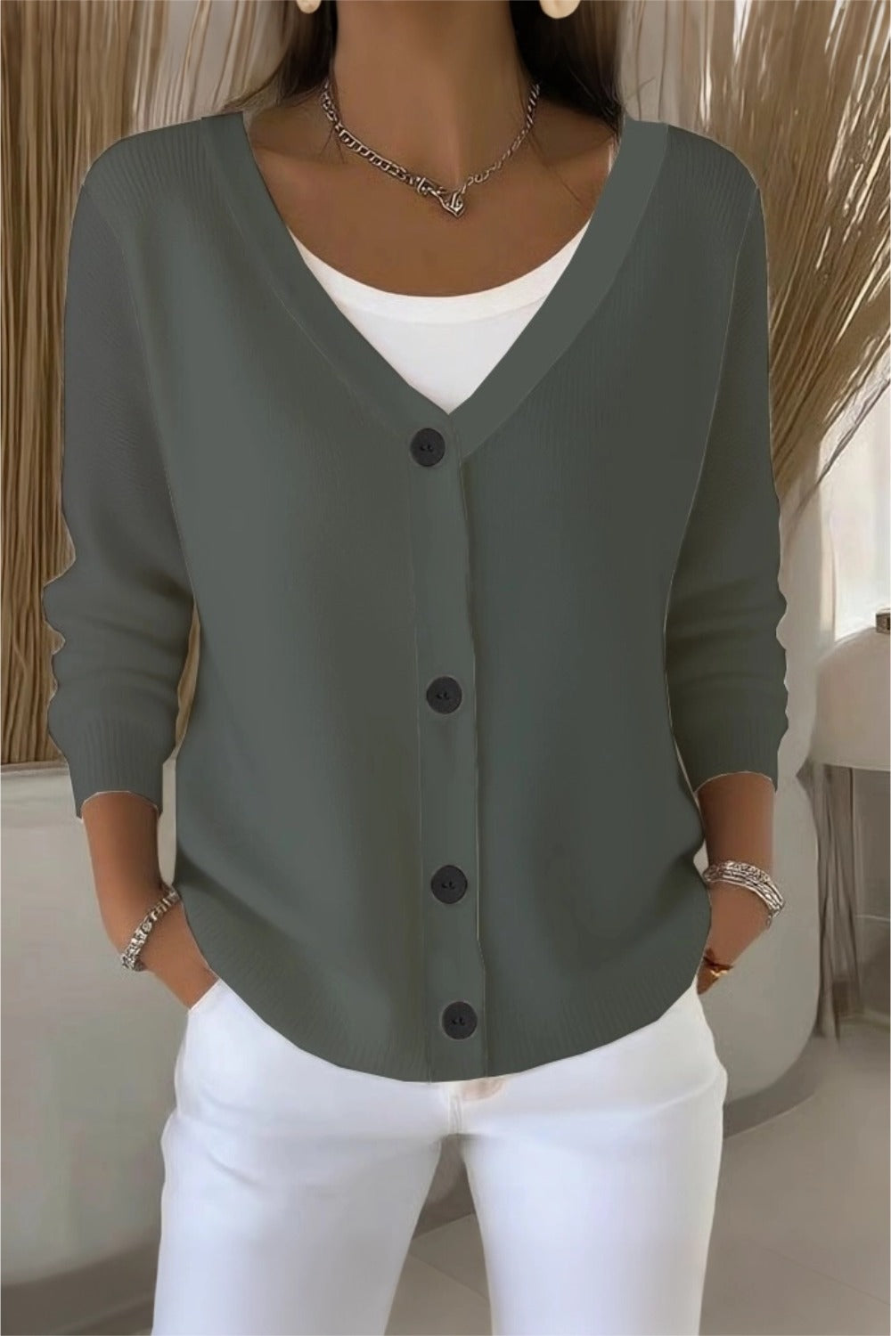 Woman wearing a plain long sleeve loose-fit V-neck casual cardigan