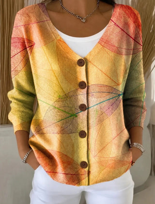 Woman wearing a yellow V-neck knit cardigan with subtle leaf texture and long sleeves