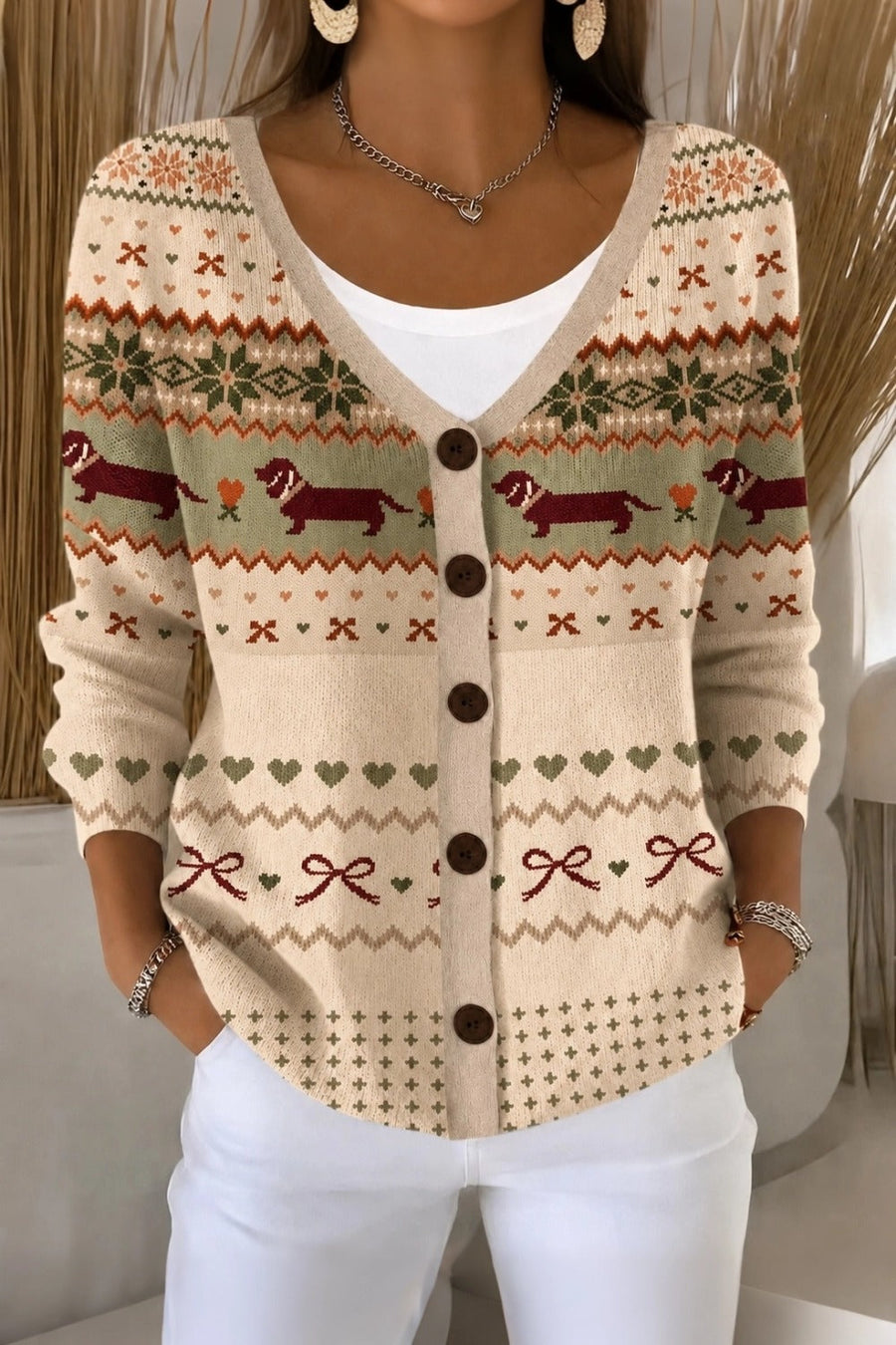 Women's loose-fit knit cardigan with playful dog motif and V-neckline