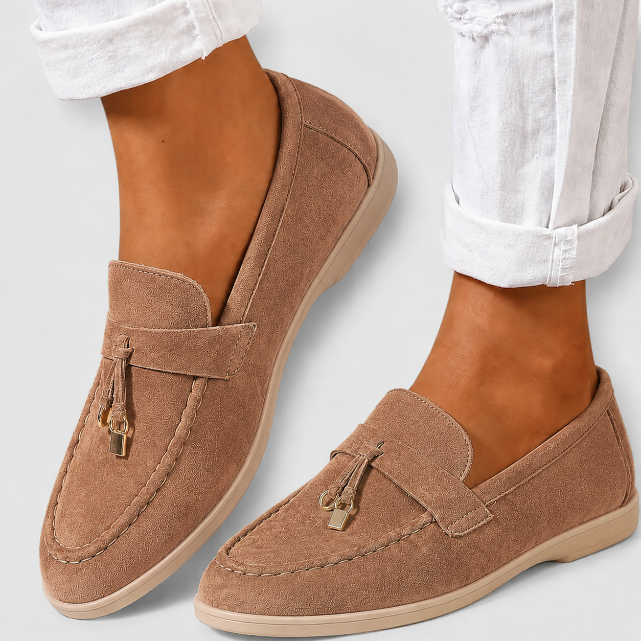 Round-toe casual loafers with a refined finish, shown in pink and camel