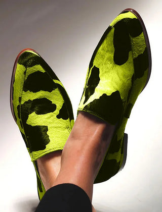 Statement animal-print loafers in a classic slip-on silhouette, shown in fuchsia and green