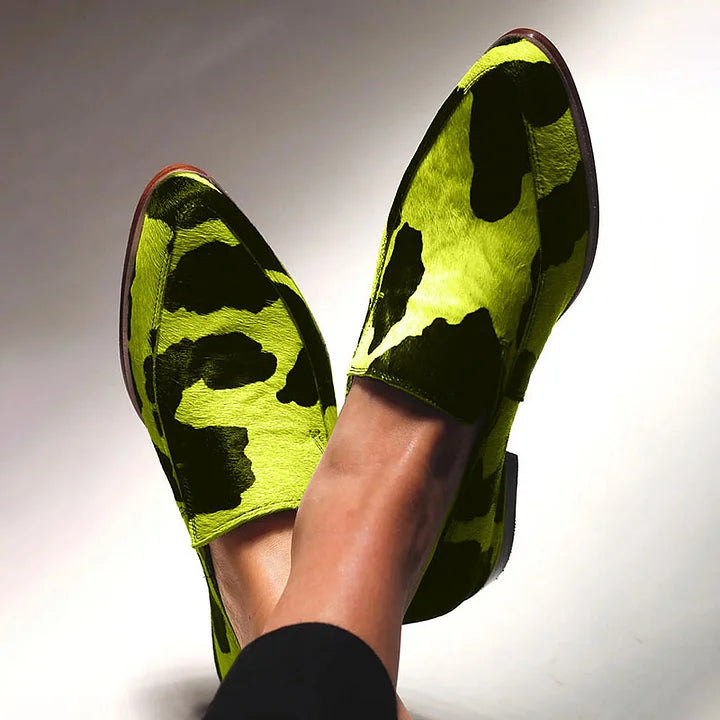 Statement animal-print loafers in a classic slip-on silhouette, shown in fuchsia and green