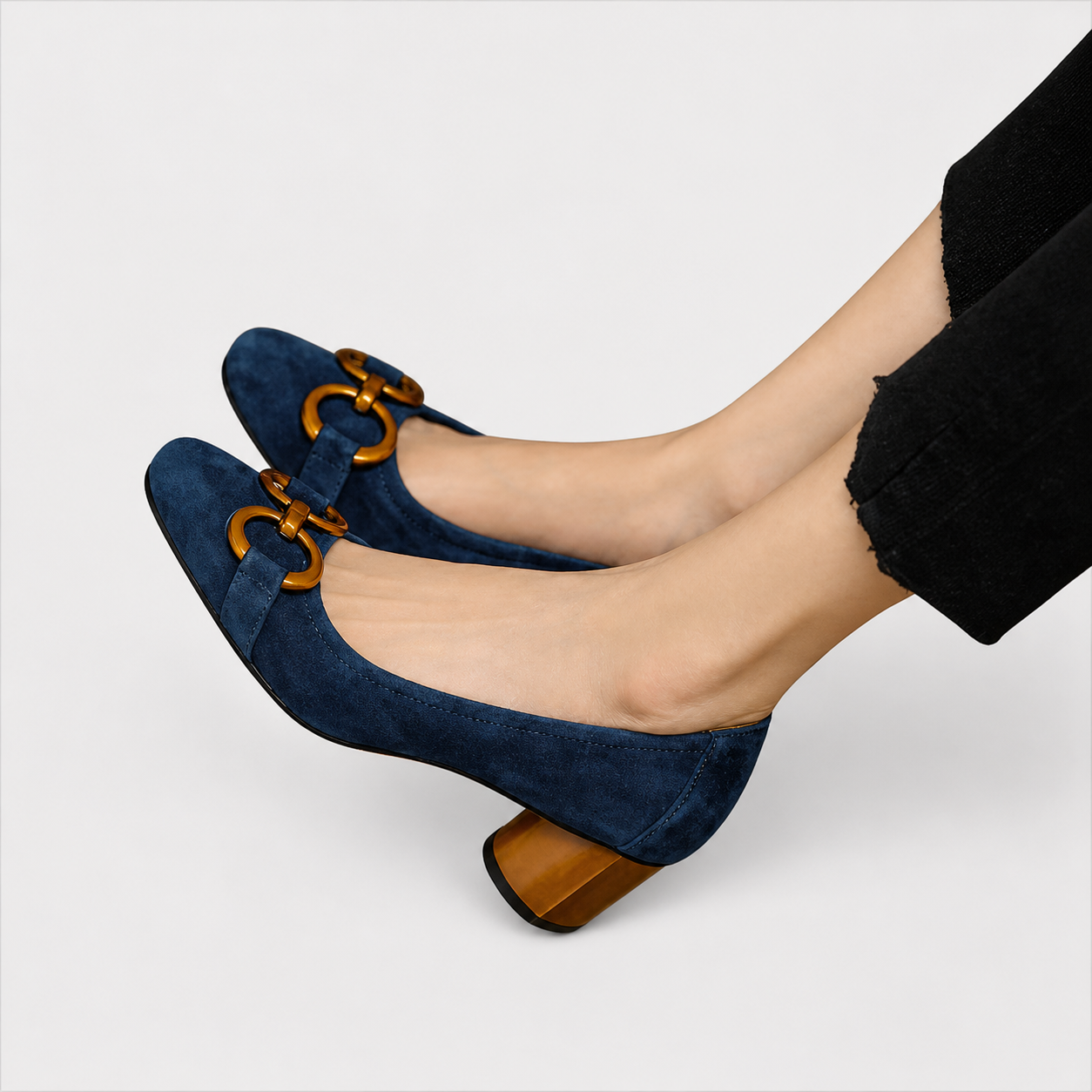 Elegant slip-on loafers shown in navy and khaki with refined detailing
