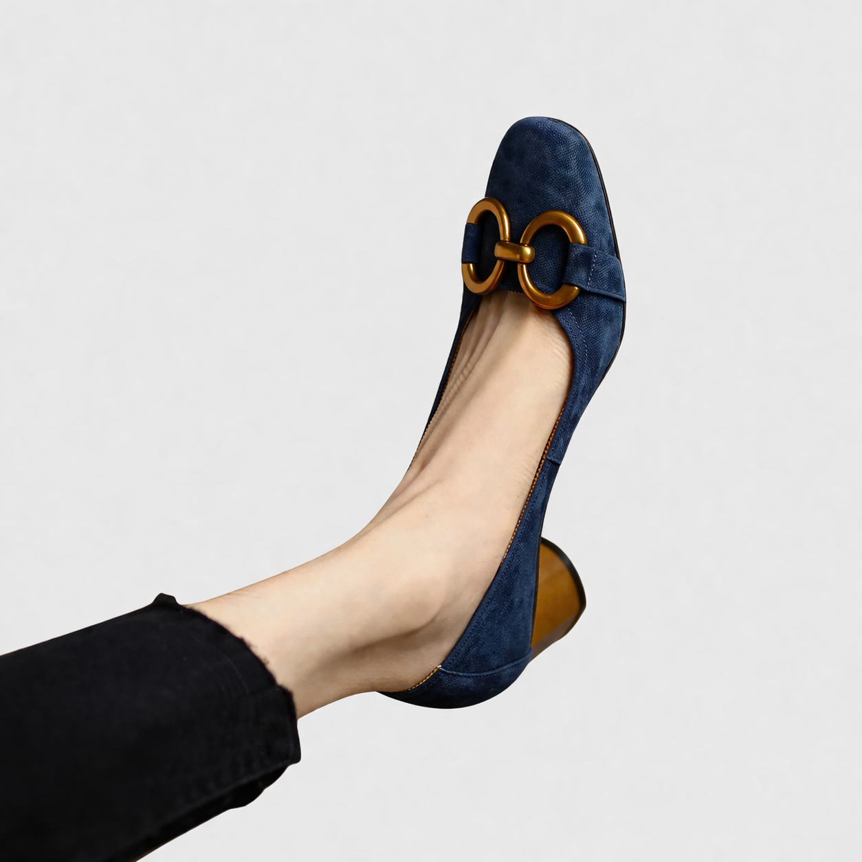 Elegant slip-on loafers shown in navy and khaki with refined detailing