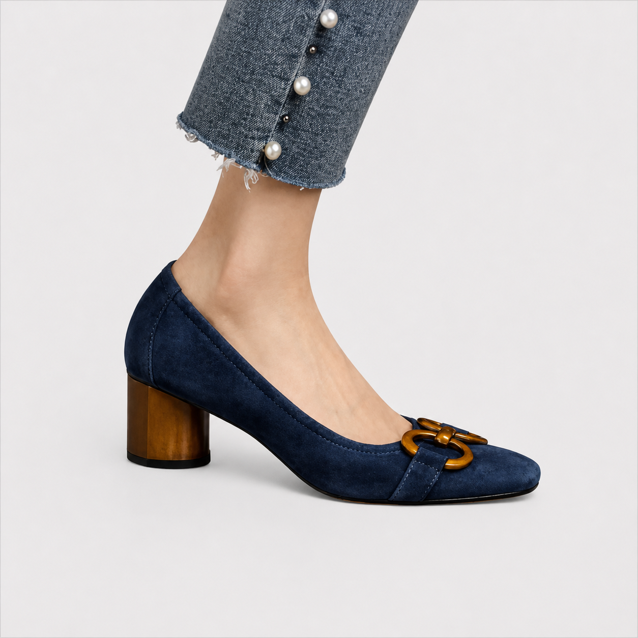 Elegant slip-on loafers shown in navy and khaki with refined detailing