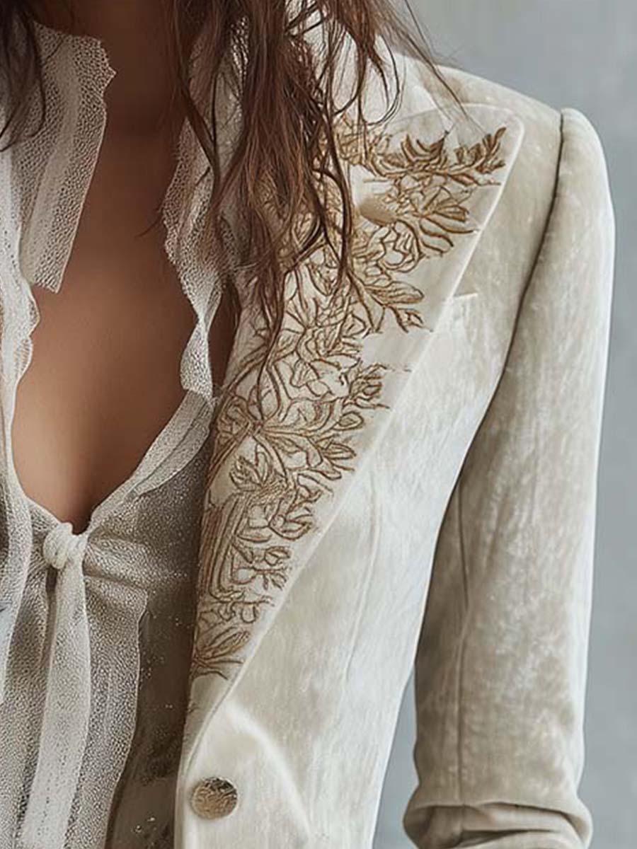 Ivory tailored blazer with gold-toned floral embroidery on the lapels and cuffs