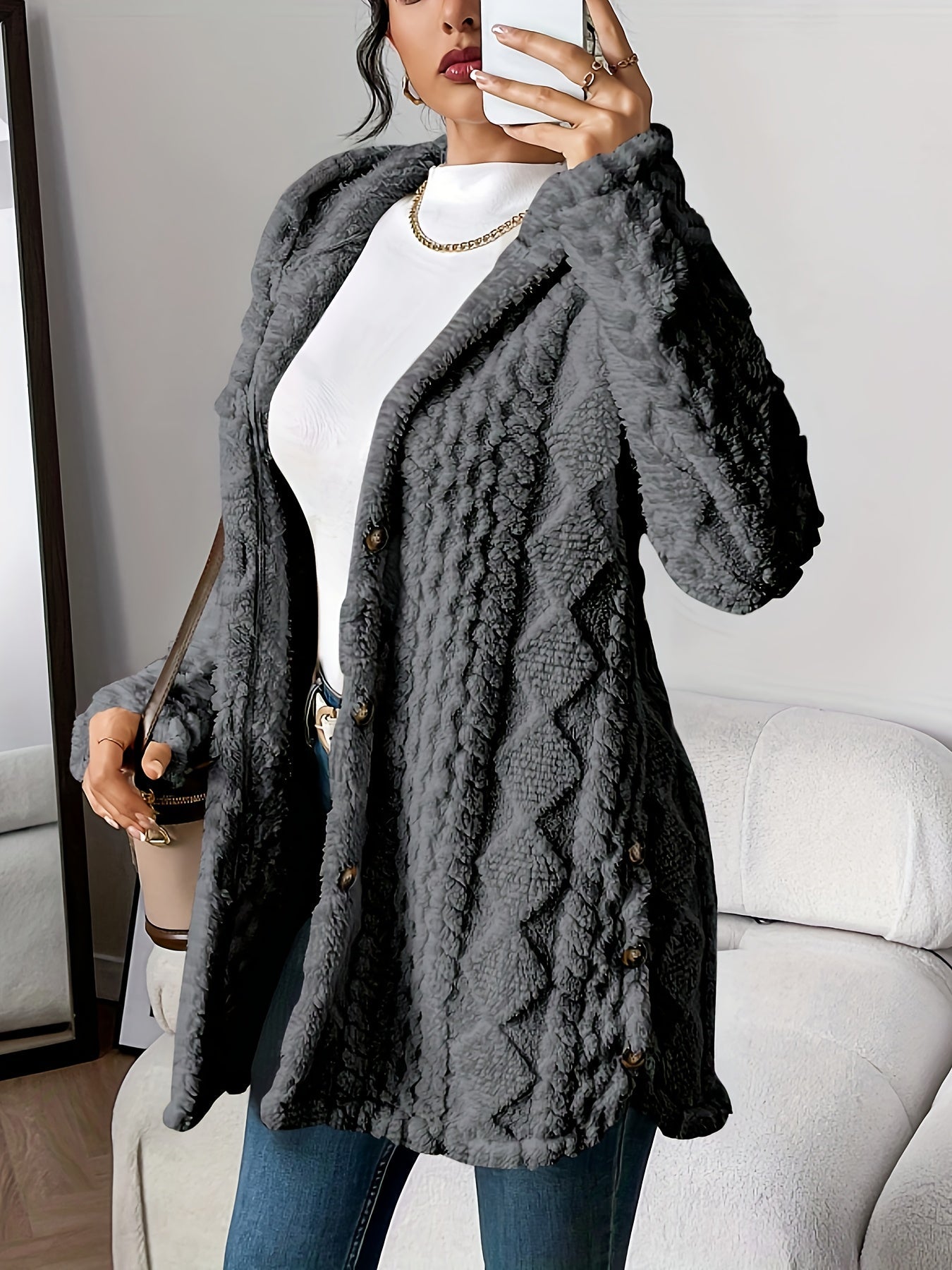 Women's hooded longline cardigan with button-front closure and raised textured surface