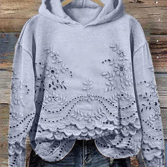 Women's floral eyelet pullover hoodie with structured hood and scalloped hem