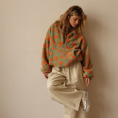 Women's floral quarter-zip sweater with stand collar and gathered cuffs in a relaxed fit