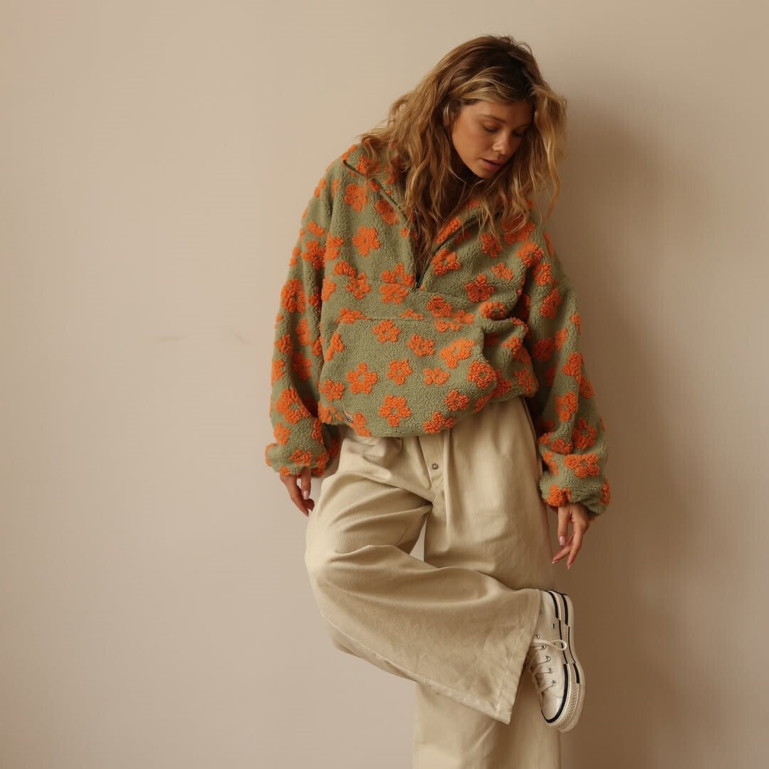 Women's floral quarter-zip sweater with stand collar and gathered cuffs in a relaxed fit