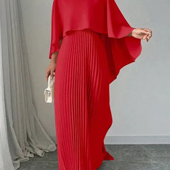 Elegant pleated cape maxi dress with flowing overlay and floor-length skirt