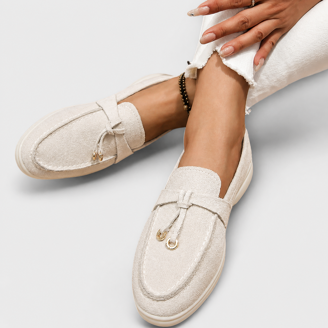 Elegant slip-on loafers shown in several neutral and colour options