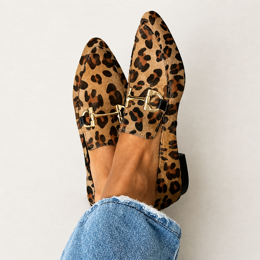 Elegant women's loafers in leopard print, shown from the side