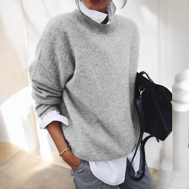 Women's solid single-tone round neck pullover sweater with long sleeves and straight hem