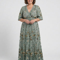 Green V-neck maxi dress with flowing floor-length skirt