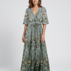 Green V-neck maxi dress with flowing floor-length skirt