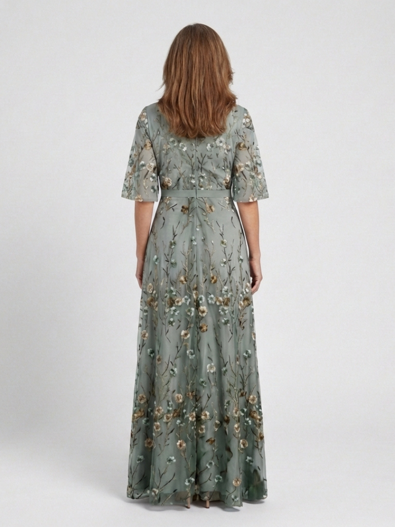 Green V-neck maxi dress with flowing floor-length skirt