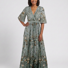 Green V-neck maxi dress with flowing floor-length skirt