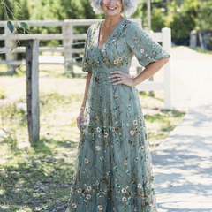 Green V-neck maxi dress with flowing floor-length skirt