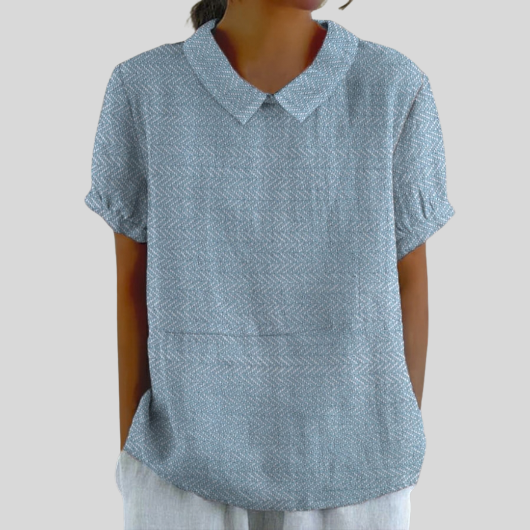 Softly textured collared short-sleeve blouse with a relaxed fit