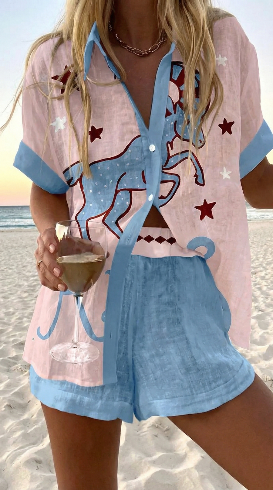 Pale pink and blue summer coordinated set with hand-drawn horse and star print and tonal blue shorts