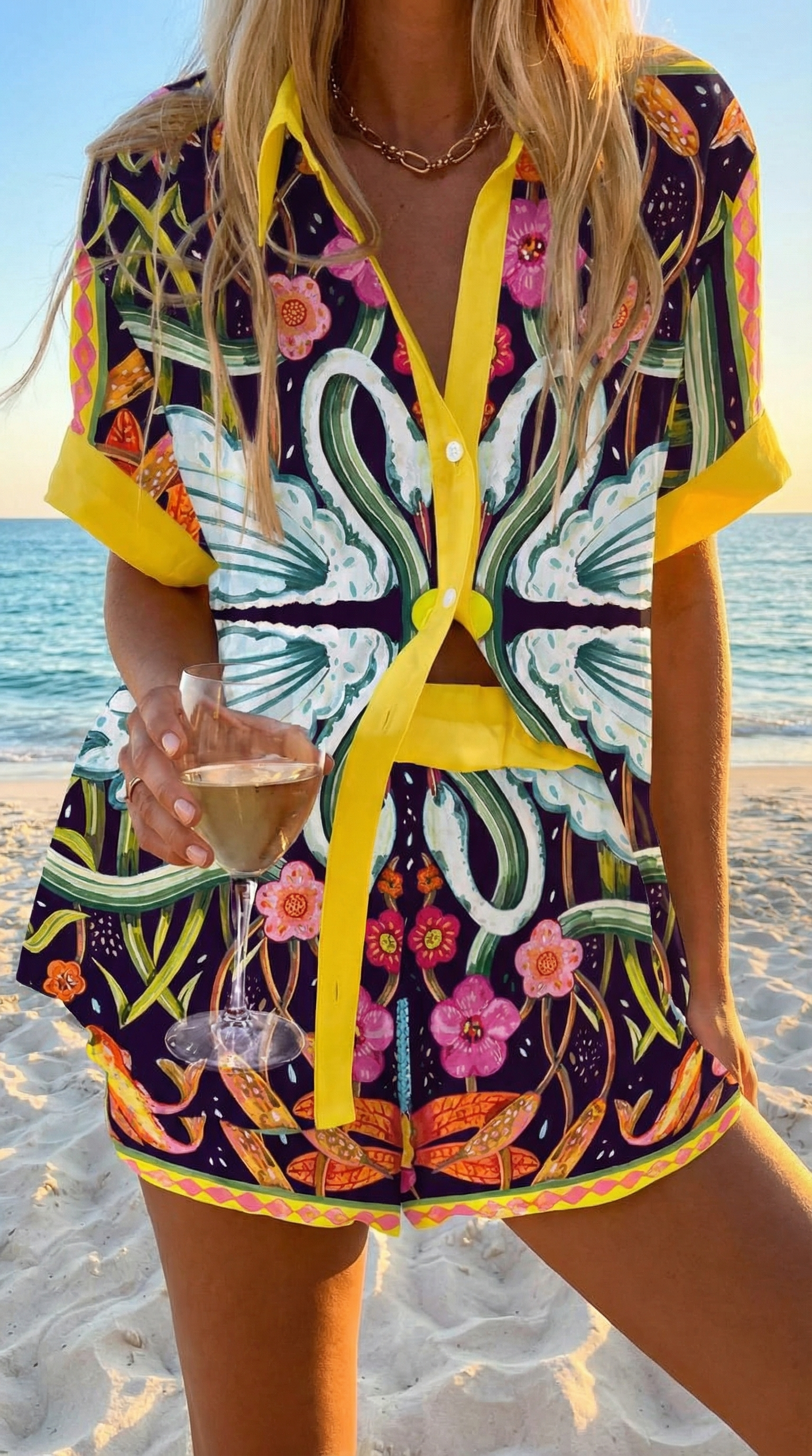 Summer coordinated set with oversized botanical print and yellow trim, matching shirt and trousers