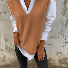 Sleeveless V-neck longline sweater vest with ribbed hem in a relaxed straight fit