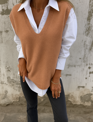 Sleeveless V-neck longline sweater vest with ribbed hem in a relaxed straight fit