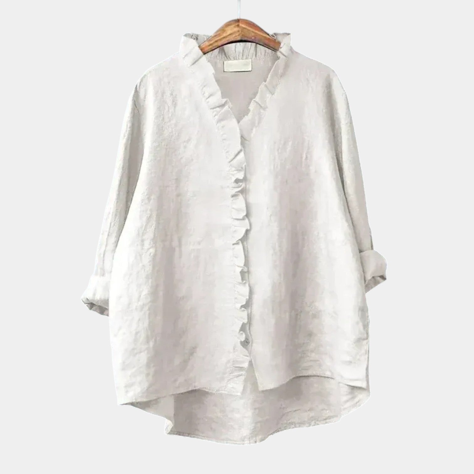 Woman wearing an elegant printed long-sleeve summer blouse in a relaxed fit