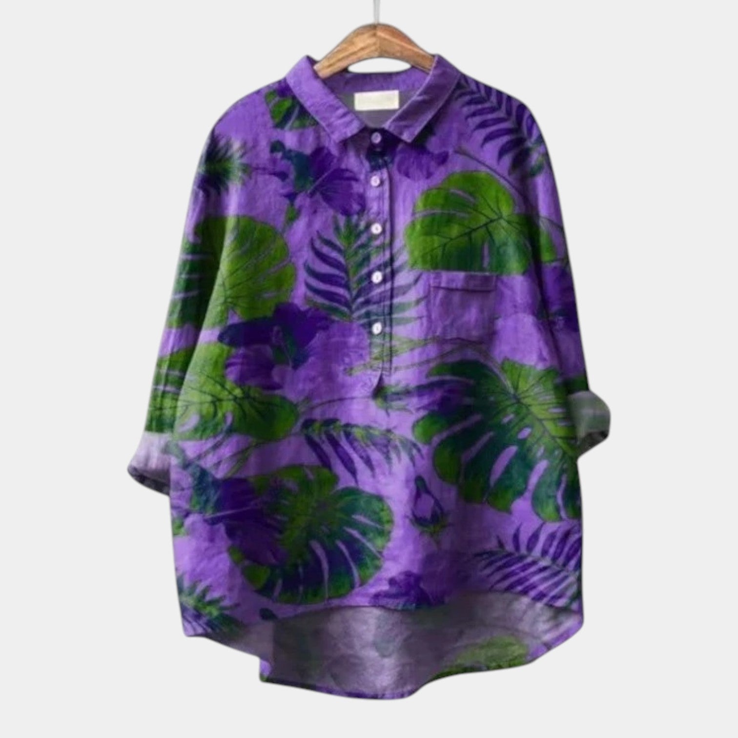 Woman wearing an elegant printed long-sleeve summer blouse styled for day and evening