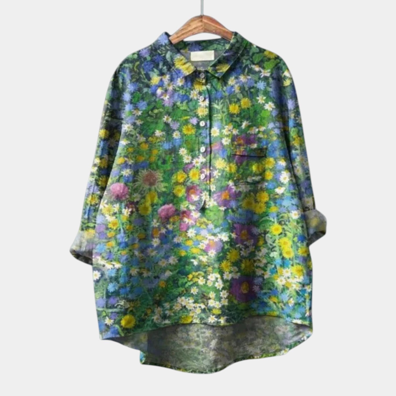 Woman wearing an elegant printed long-sleeve summer blouse in a relaxed fit