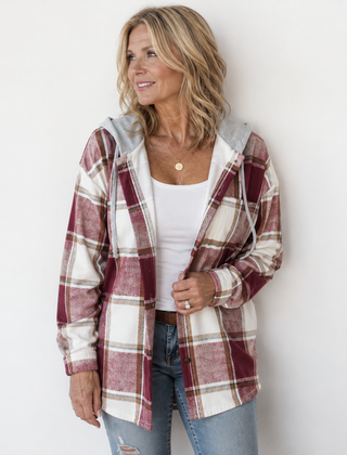 Woman wearing a cosy plaid hooded jacket with a soft, comfortable fit